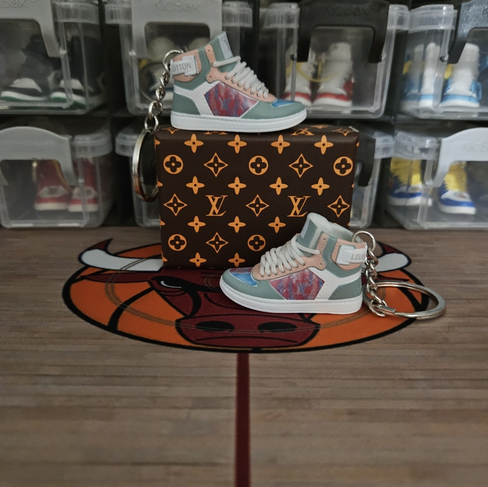 Fashion pair of mini sneakers keychain.